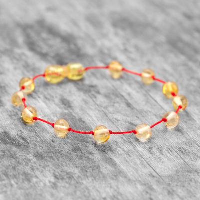 Brățară din chihlimbar cu mărgele galbene și șnur roșu