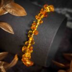 Bratara dama din chihlimbar maro miere cu pietre in forma de picaturi de apa mari si mici