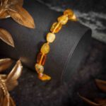 Bratara chihlimbar german, culoare galben cu nuante de miere, coniac si unt, pietre neregulate